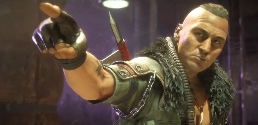 Close de Kabal ferido e mascarado após a invasão de Shao Kahn, destacando queimaduras e respiradores