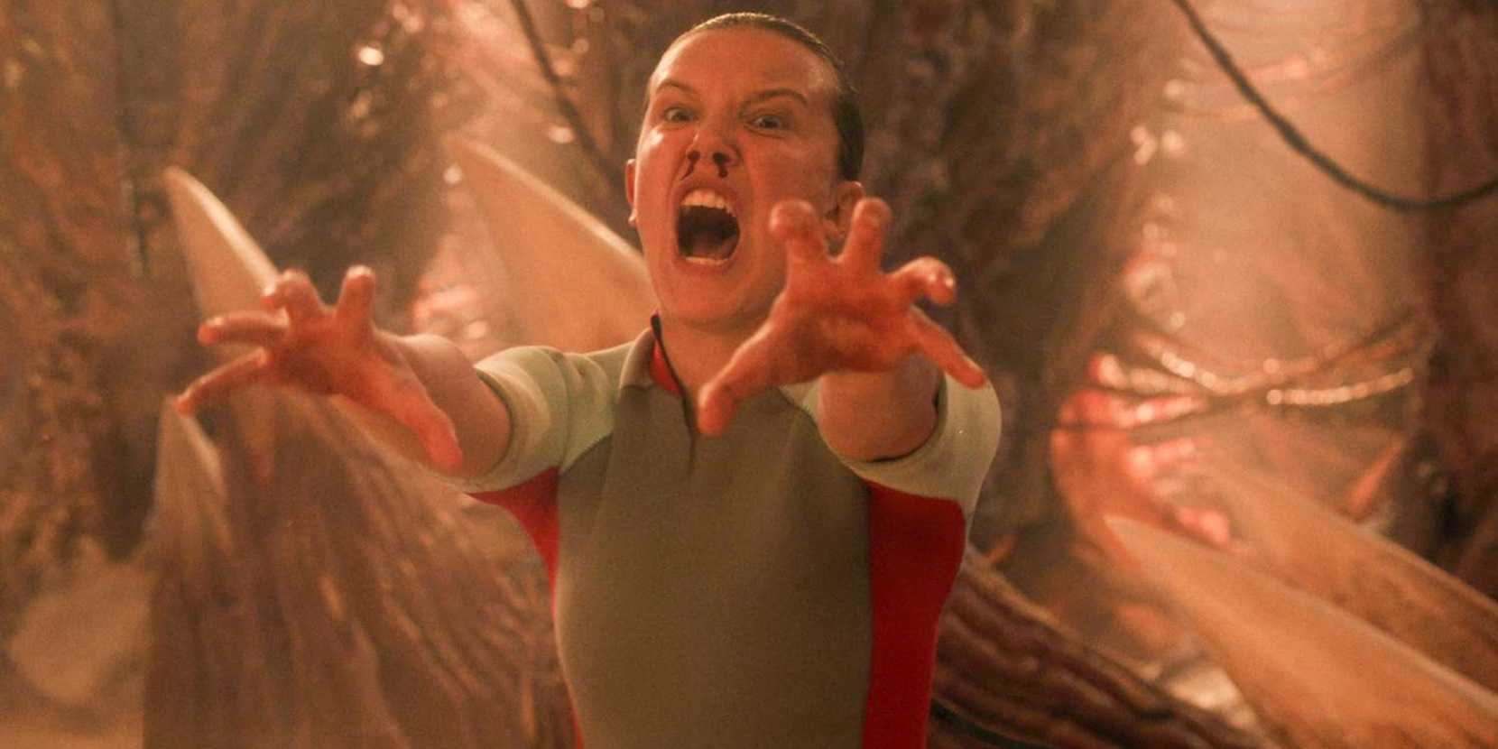 Eleven com as mãos estendidas no final de Stranger Things