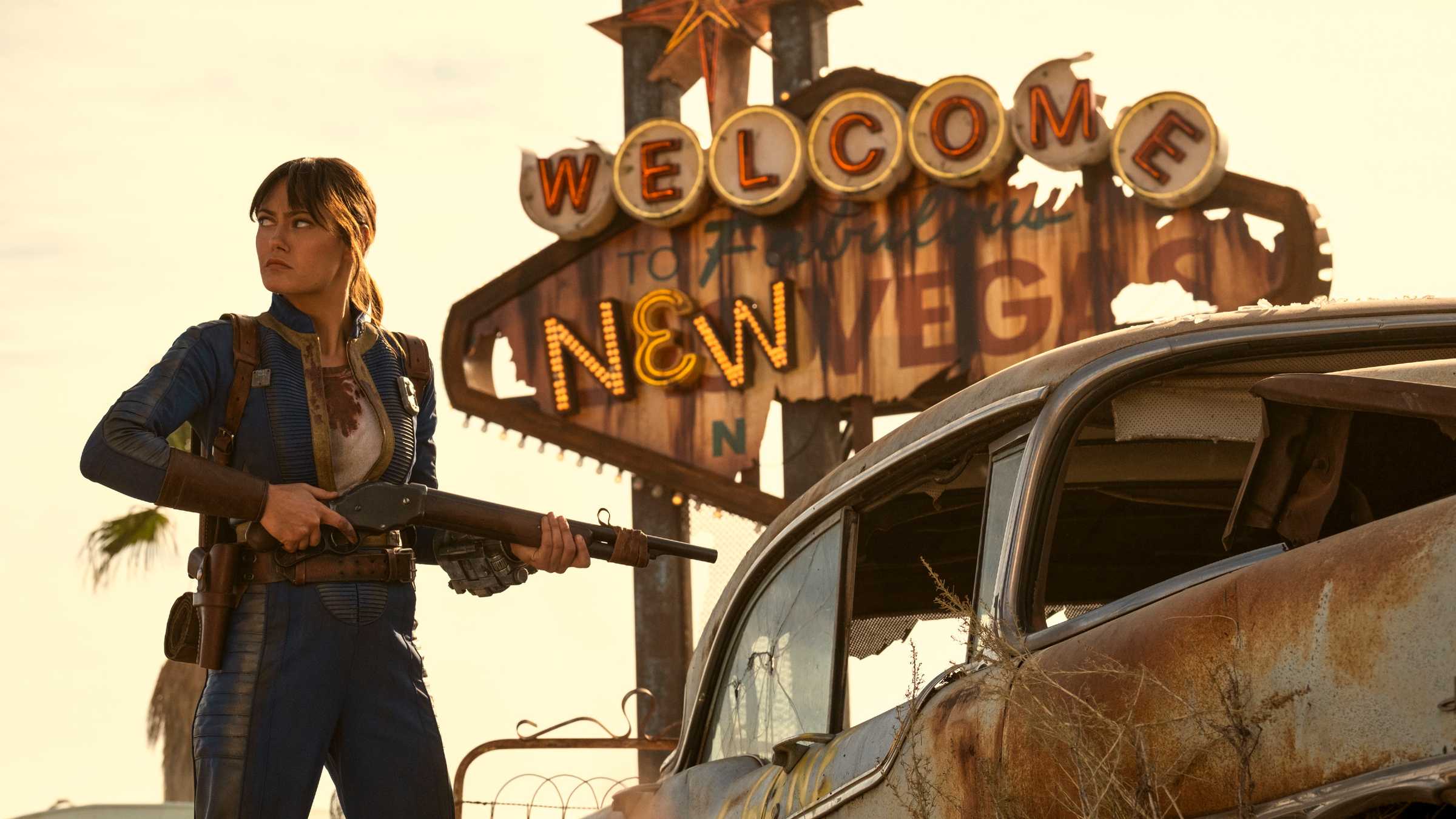 Fallout still featuring Lucy in front of a New Vegas sign.