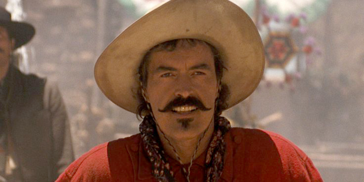 Powers Boothe como Curly Bill em Tombstone