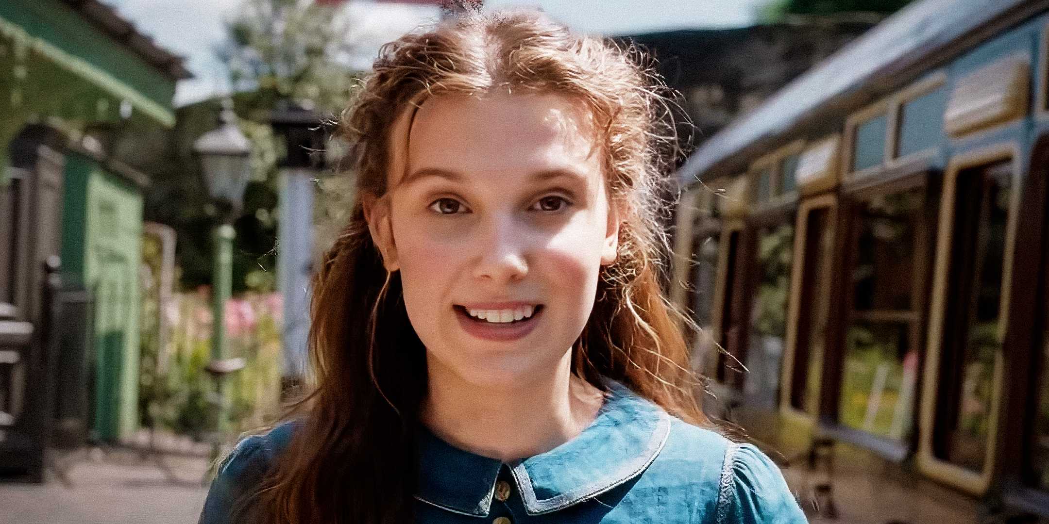 Millie Bobby Brown smiling as Enola Holmes